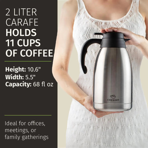 Person holding Thermal Coffee Carafe 68 Ounce 2 Liter Insulated Stainless Steel Beverage Dispenser Keeps Coffee Tea Cocoa Hot Up To 12 Hours Party Ready Large Tea Flask