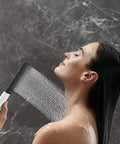Woman using Rainfinity 2 Inch Modern Handheld Shower Head With PowderRain Jet Chrome Finish for spa-like relaxation