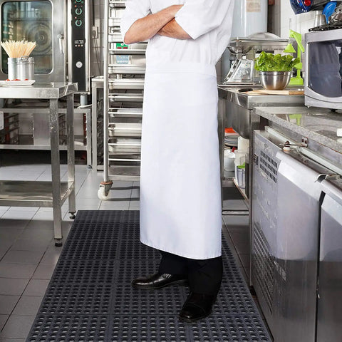 Chef standing on Anti Fatigue Drainage Rubber Floor Mat Roll 83 By 36 Inch Non Slip Heavy Duty For Kitchen Bar Restaurant Wet Areas With Holes