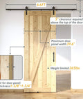 Lite Version Black 6.6 Foot Barn Door Hardware Kit with Sliding Track System installed on a wooden door in a home setting.