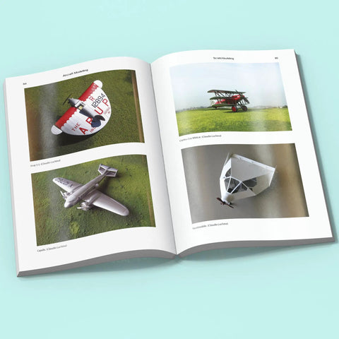 Open book displaying aircraft models for Conversions and Scratchbuilding Masterclass for Aircraft Modeling with Hands On Pro Tips.