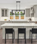 Iverson 34 Inch 4 Light Farmhouse Rectangular Island Light With Clear Cylinder Glass Shades In Oil Rubbed Bronze Finish above kitchen island