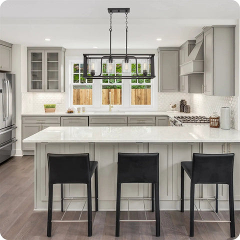 Iverson 34 Inch 4 Light Farmhouse Rectangular Island Light With Clear Cylinder Glass Shades In Oil Rubbed Bronze Finish above kitchen island