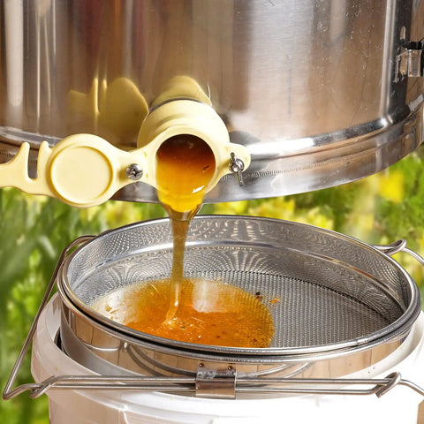 Honey flowing into Stainless Steel Honey Strainer With Double Sieve For Beekeeping Gear, Mesh Filter Screen, 9 Inch Diameter, 4 Inch Depth