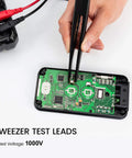Hands using tweezer test leads on circuit board, part of 23 Piece Multimeter Test Lead Kit With Replaceable Probes, Alligator Clips.