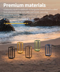 Cordless Waterproof Table Lamps Set of 2 Black Outdoor Go-To Rechargeable Desk Lamps on a beach at sunset