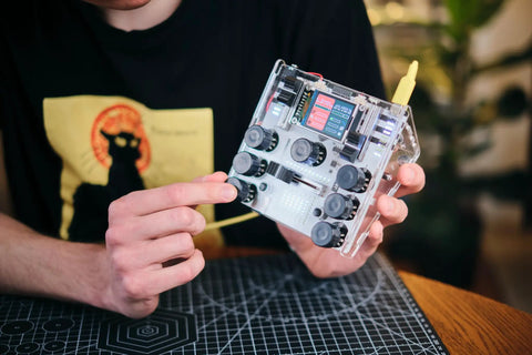 DIY DJ Mixer Kit For Beginners Teens Build Your Own DJ Board Learn Electronics Mix Tracks Add Effects Play Music Via SD Card Kid Friendly STEM Project That Feels Like Real DJing held in hands