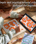 Person using Plant Themed Punch Needle Kit For Adults And Beginners, All In One Embroidery Craft Set With 25cm Hoop, tablet and instructions visible.