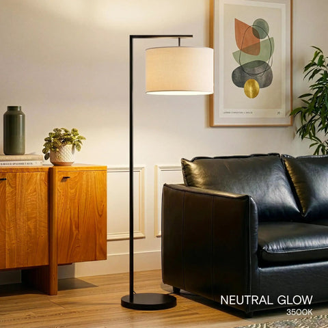 Modern LED Floor Lamp With Tan Fabric Shade Tall Corner Pole Standing Light For Living Rooms And Offices Ideal Bedroom Reading Light Black Finish That Fits Contemporary Home Decor And Brings A Bright Warm Vibe To Any Space next to black sofa and wooden cabinet