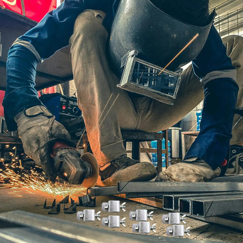 Worker using grinder with 8 Piece Butt Welding Clamps Set For Edge To Edge Welds And Patch Repairs On Auto Body Panels foreground