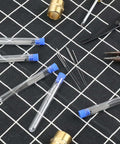 Bulk 50 Pieces 0.4 mm Stainless Steel 3D Printer Nozzle Cleaning Kit With Storage Bottles, needles and tools on grid surface
