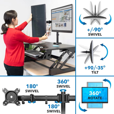 Person adjusting dual monitor standing desk converter with 36 inch wide surface, height adjustable riser with gas spring and mounts.