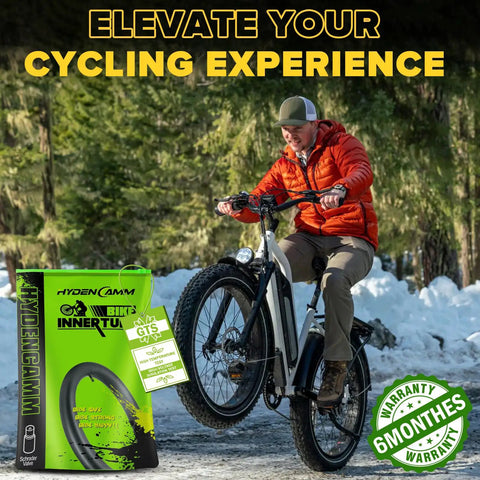 Cyclist on e-bike with Two Pack 20x4 Fat Tire Inner Tube With 32mm AV Schrader Valve For 20 Inch Fat Bikes Fits 20x3.5-4.0 Tires Includes 2 Tire Levers