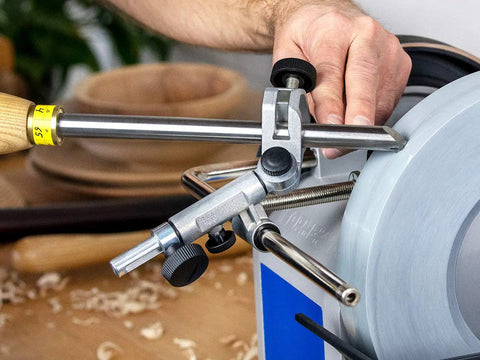 SVD-186 R Gouge Jig For Sharpening Woodturning And Woodworking Tools in use, showing metal components and adjustment knobs