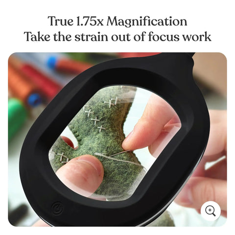 Close-up of hands sewing through magnifier of LightView Pro Magnifying LED Desk Lamp With Flexible Gooseneck And 3 In 1 Magnifier