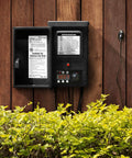 300 Watt Outdoor Landscape Lighting Transformer With Sensor And Weather Shield For Low Voltage Systems mounted on wood panel