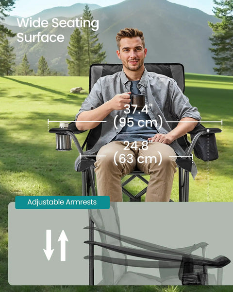 Man sitting in Oversized Camping Chair With Cup Holder And Cooler Bag Heavy Duty Folding Lawn Seat, adjustable armrests shown, outdoors.