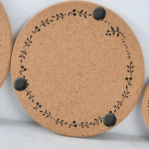 Cork pad with floral design and black non-slip feet, similar to Non Slip Rubber Leg Caps Eight Pack Thickened Design Furniture Pads.