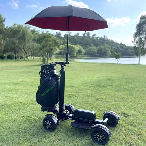 Foldable Electric Golf Push Cart With Cushioned Seat And Sturdy Umbrella Pole on grass beside a pond.