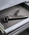 90-Degree Locking Grip Hose Clamp Pliers resting in a tool drawer, black finish, designed for secure clamp removal in auto and aviation work.