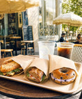 Greaseproof Paper Sandwich Bags 200 Pack 7 By 6 By 1 Inches Unbleached Brown Bags with bagels and sandwiches at cafe