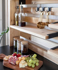 Close-up of cedar wood shelves and black hooks from 48 Inch Cedar Wood Buffet Hutch Serving Station With Galvanized Steel Countertop