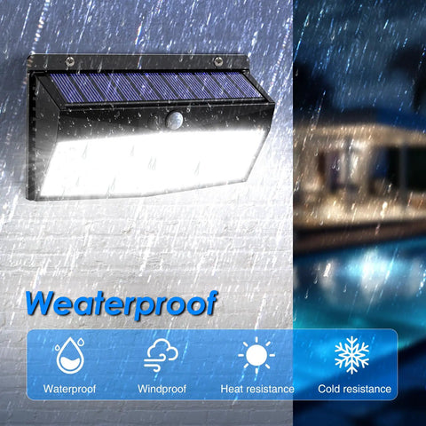 Weatherproof LED Solar Lights Outdoor Motion Sensor With 3 Lighting Modes in use, mounted on wall in rain