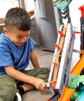 Child playing with City Car Wash Play Set With Giant Gator Color Change Fun Elevator Lift And Rolling Brush Track For Kids