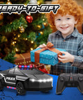 Smiling child holding a gift with All Terrain RC Police Car Toy One Twenty Two Scale With 2 Point 4 GHz Remote in foreground