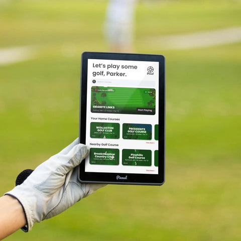 Gloved hand holding Portable Golf GPS Tablet The Caddie With 8 Inch Touchscreen And Magnetic Weatherproof Body FCB Distances