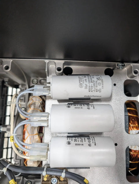 Rock Solid Pto Generator Package Serving A Knockout 16 Kilowatt Single Phase Setup showing internal capacitors and copper windings.