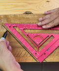 Hands using 7.5-Inch Magnetic Rafter Square With Jig Block Multi-Angle Measuring Tool For 90-Degree And 180-Degree Angles on wood