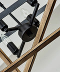Close-up of 4 light rustic farmhouse chandelier with oil rubbed bronze finish, industrial hanging light fixture detail view.