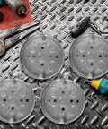 4-Pack Shallow Round Electrical Boxes For Ceiling Pancake Installations, 1/2-Inch Deep, 1/2-Inch Knockouts, 4-Inch Diameter in galvanized steel on a metal surface with tools