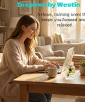 Woman working at desk with White Tea Reed Diffuser Set Inspired by Westin Hotel Scent for a 5 Star Home and Office Vibe, 3.34 Fl Oz