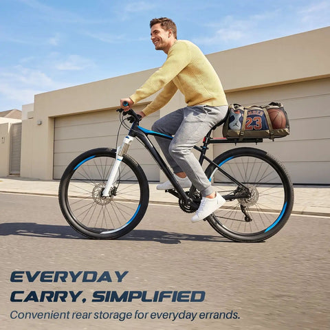 Person cycling with Adjustable Rear Bike Carrier Rack With 20Lb Capacity Universal Extendable Aluminum Cargo Rack on rear