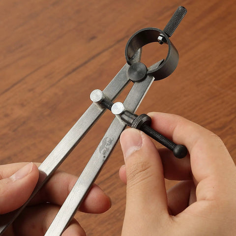 Professional All Metal Drafting Compass With Lockable Slider And Pencil Holder in hand, showing lock slider and pencil holder details.