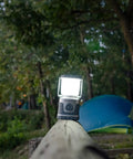 60 Day Portable LED Lantern With 1200 Lumen Power illuminating a campsite at dusk, showing lifetime LED bulbs and built-in hook.