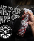 All In One Interior Cleaner And Protectant With Black Cherry Scent, 16 Oz, Safe On Leather, Vinyl, Plastic, Rubber And Glass, Cleans, Protects, And Refreshes Dash, Doors, And Panels For A Factory Clean Look And Fresh Car Vibe. spray bottle in hand