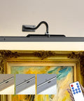 Wireless Rechargeable Picture Light Black 24 Inch Wall Sconce With Remote And Timer illuminates art with adjustable tones and remote control.