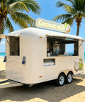 15 Foot White Food Trailer Fully Equipped No Sweat Turnkey Mobile Kitchen With Stainless Prep Area Plug And Play Beverage Station Road Ready Catering Rig Built Tough For Any Local Event exterior view on the beach.