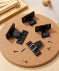 20 Piece Push On Furniture Panel Clips With Dead Easy Hidden Cabinet Mounting And Quick Fit Shelf Brackets In Tough Black Nylon arranged on a cork round.