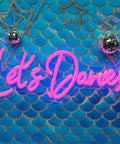 Lets Dance Neon Sign Pink LED Word Light for Weddings and Parties on blue scalloped background with disco balls