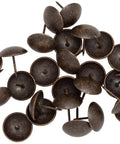 Top Shelf One Inch Upholstery Tacks With A Sleek Dark Antique Brass Finish Heavy Duty Nailhead Pins in a pile.