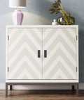 White cabinet with zigzag pattern and black sliding closet door pulls, displayed in a modern room setting.
