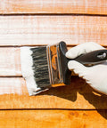 Hand applying One Coat Wood Sealer Cream Clear One And A Half Gallon Outdoor Treatment That Weatherproofs For 10 Years Waterproofs Decks