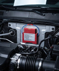 Badass Automatic Fire Extinguisher Stickers For Engine Bay, red aerosol device mounted in an engine bay for fire suppression.