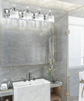 Chrome 4 Light Crystal Vanity Light Over Mirror With Dimmable E26 Sockets Modern Bathroom Lighting Upgrade Your Bath With Crystal Shine Glam Up Your Space Bulbs Not Included installed above a bathroom mirror, reflecting light on a marble wall.
