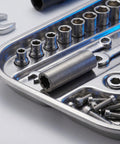 Heavy Duty Steel Shaft Coupling For Auto Lift Motors With Efficient Torque Transfer And Vibration Reduction Sturdy Silver Garage Hardware Upgrade Your Shop Setup Now on a metal tray with wrenches and sockets.