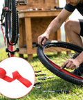 Red 26 Inch Bicycle Rim Tape 4 Pack Elastic PVC Nylon Rim Strips Protect Inner Tube From Spoke Holes And Sharp Edges High Pressure Puncture Resistant Wheel Liner For Mountain And Road Bikes installation on a bike.